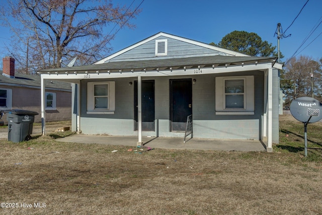 bungalow-style house featuring a front yard and a porch