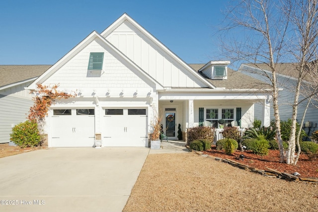 view of front of property with a porch and a garage