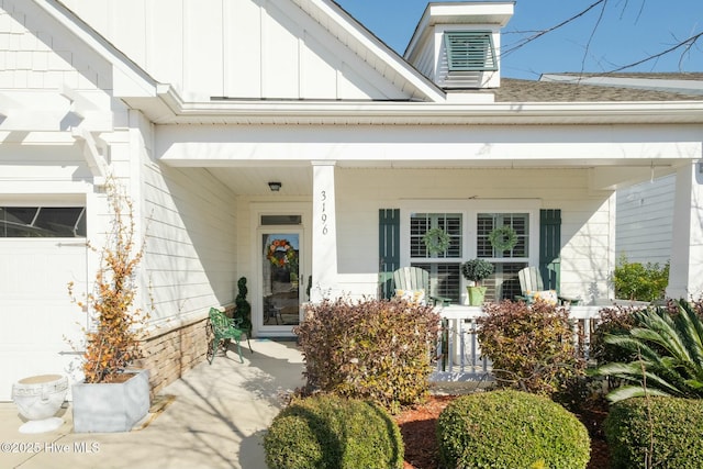 property entrance featuring a porch and a garage