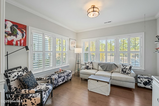 living room with crown molding and dark wood-type flooring