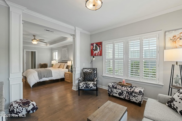 bedroom featuring decorative columns and dark wood-type flooring