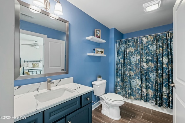 bathroom with vanity, ceiling fan, and toilet