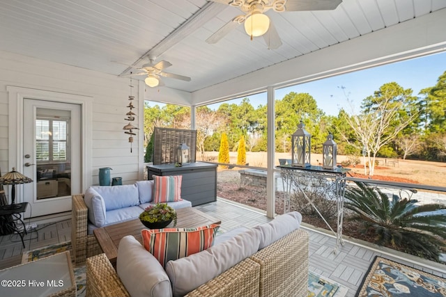 sunroom / solarium with ceiling fan