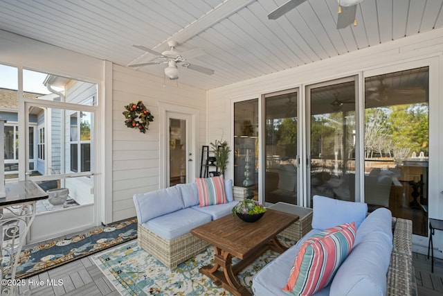 sunroom / solarium featuring ceiling fan and wooden ceiling