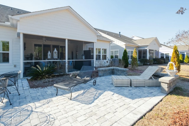 exterior space featuring a sunroom and ceiling fan