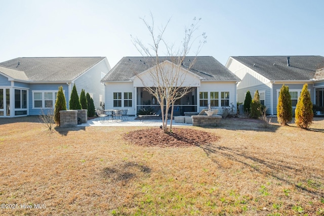 back of house featuring a yard, a patio area, a sunroom, and central AC