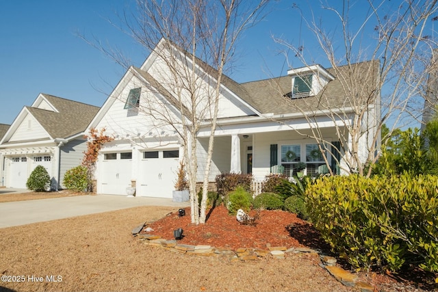 view of front facade with a garage and covered porch