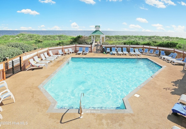 view of pool with a gazebo and a water view