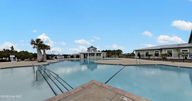 view of swimming pool featuring a patio area