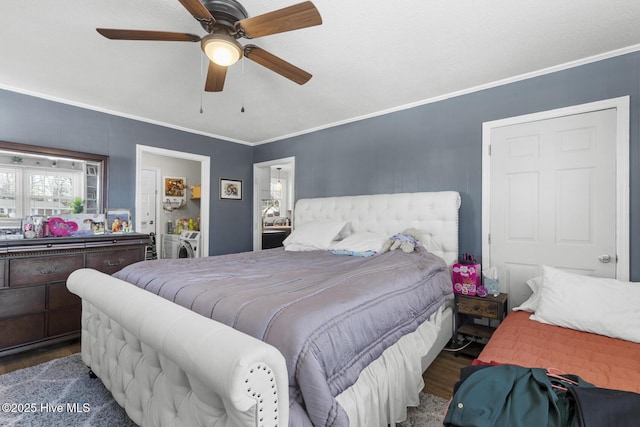 bedroom featuring independent washer and dryer, ceiling fan, ornamental molding, and dark wood-type flooring