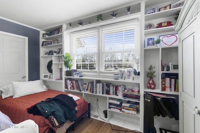 bedroom featuring dark hardwood / wood-style floors