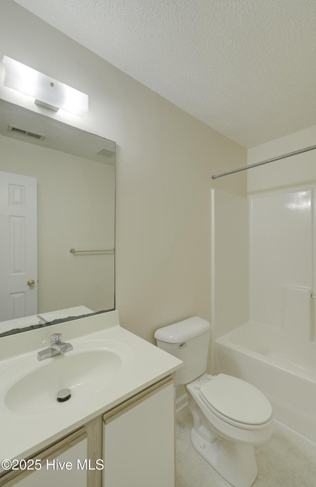 full bathroom featuring a textured ceiling, shower / bathtub combination, vanity, and toilet