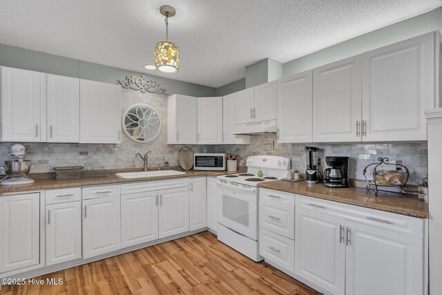 1126 Ccc Rd, Sneads Ferry, NC 28460 - kitchen with decorative light fixtures, white cabinets, sink, and white electric stove