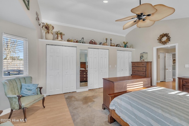 1126 Ccc Rd, Sneads Ferry, NC 28460 - bedroom with ceiling fan, two closets, vaulted ceiling, and light wood-type flooring