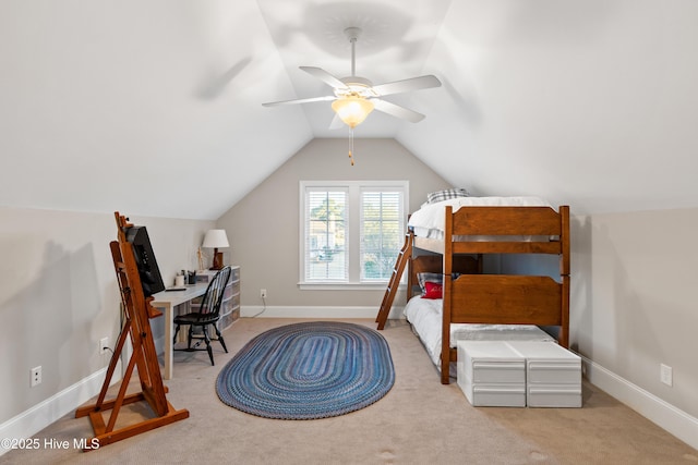 carpeted bedroom featuring ceiling fan and vaulted ceiling