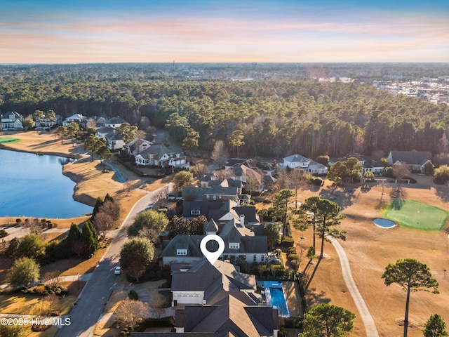 aerial view at dusk with a water view