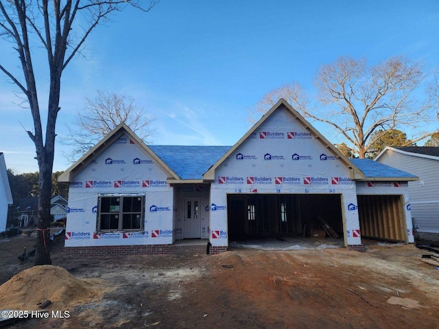 property in mid-construction with a garage