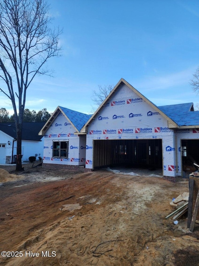 property under construction with a garage