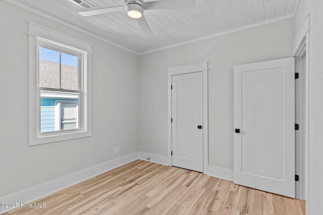 bathroom with toilet, a shower with shower door, and hardwood / wood-style flooring