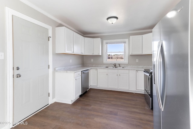 kitchen featuring white cabinets, stainless steel appliances, sink, dark hardwood / wood-style floors, and crown molding