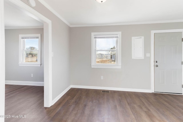 foyer entrance with dark hardwood / wood-style floors and ornamental molding