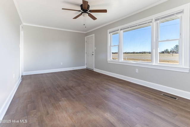 unfurnished room featuring ceiling fan, crown molding, and dark hardwood / wood-style floors