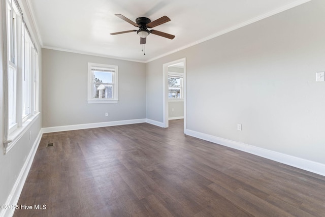 unfurnished room with ceiling fan, dark hardwood / wood-style flooring, and crown molding