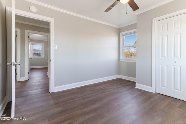 unfurnished bedroom with ceiling fan, a closet, and multiple windows