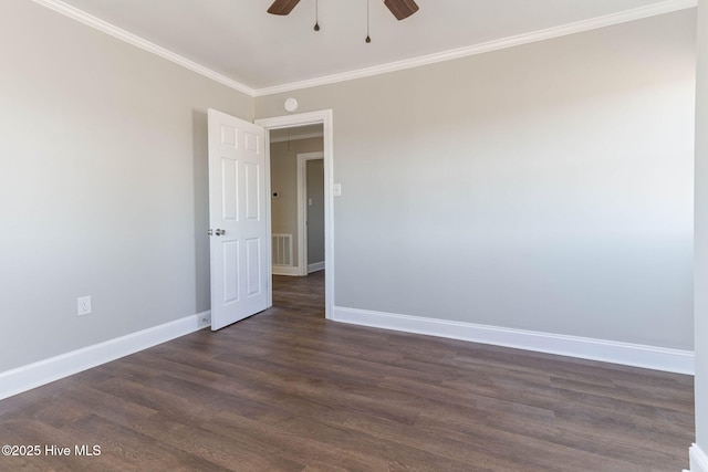 unfurnished room with ceiling fan, dark hardwood / wood-style flooring, and ornamental molding