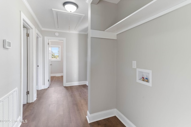 washroom with washer hookup, crown molding, and hardwood / wood-style flooring