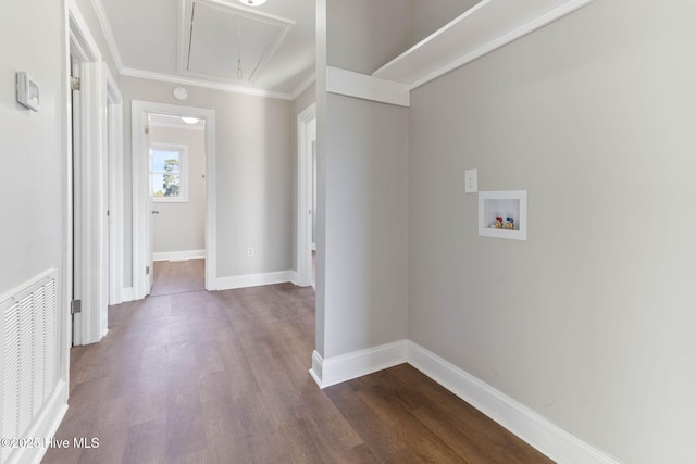 laundry area featuring dark hardwood / wood-style flooring, washer hookup, and crown molding