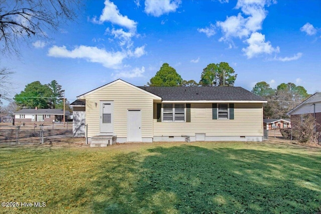 back of house featuring a yard