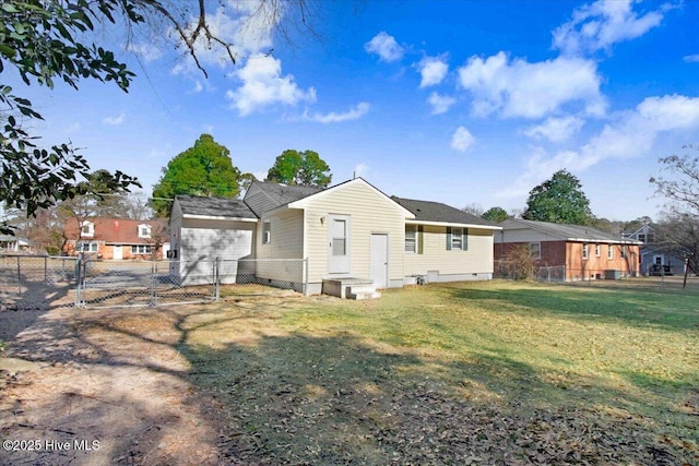 back of house with a yard