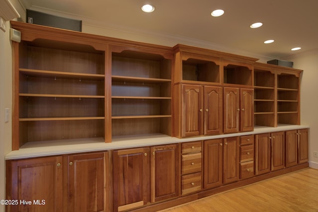 interior space featuring a sauna, recessed lighting, light wood finished floors, and ornamental molding