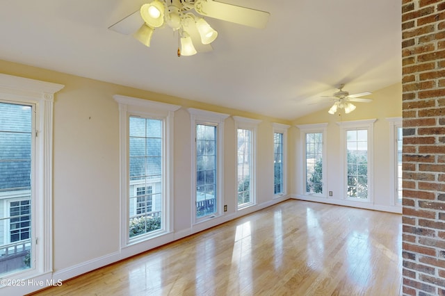 interior space featuring light wood-type flooring, ceiling fan, and lofted ceiling