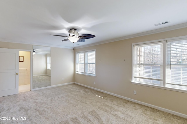 unfurnished bedroom with light carpet, ensuite bathroom, ceiling fan, ornamental molding, and multiple windows