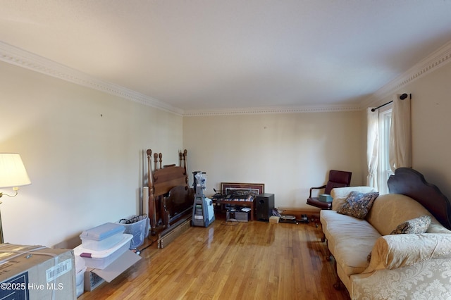 living room with ornamental molding and light wood-type flooring