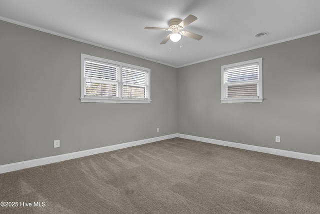 carpeted empty room with ceiling fan and ornamental molding