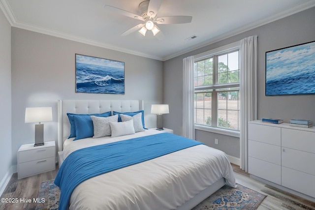 bedroom with ceiling fan, multiple windows, ornamental molding, and light wood-type flooring