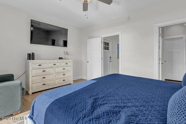 1788 New River Inlet Rd, North Topsail Beach, NC 28460 - bedroom with light wood-type flooring and ceiling fan