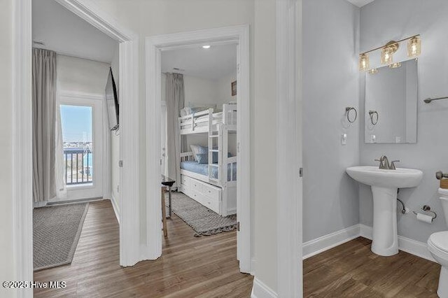 1788 New River Inlet Rd, North Topsail Beach, NC 28460 - bathroom featuring wood finished floors and baseboards