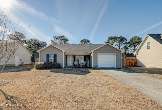 ranch-style home featuring a garage and a front lawn