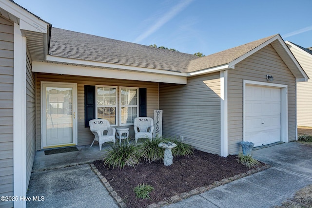 entrance to property with a garage and a porch