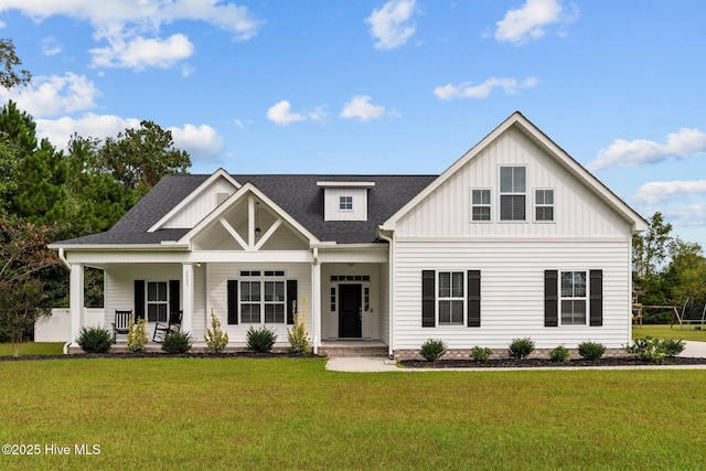 view of front of house featuring a front yard and covered porch