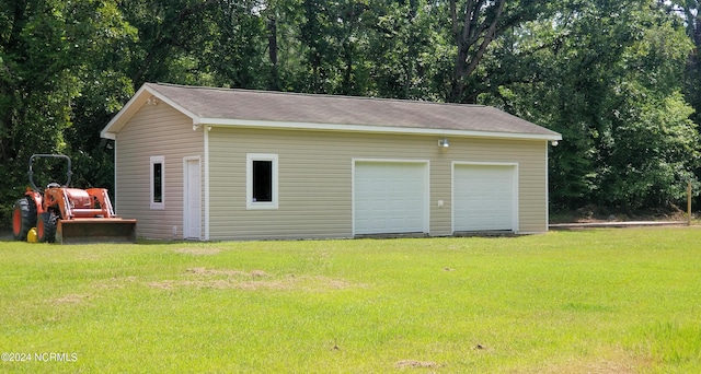 garage with a lawn