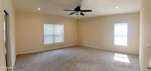 empty room with light carpet and ceiling fan