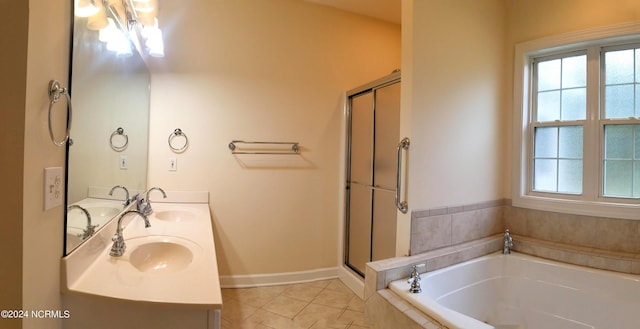 bathroom with tile patterned flooring, separate shower and tub, and vanity