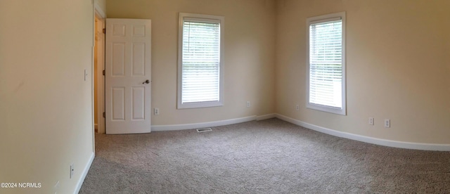 unfurnished room with carpet floors