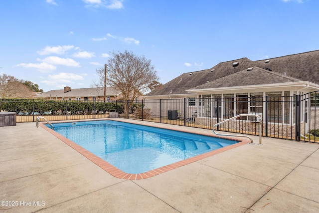 view of swimming pool featuring a patio area and central AC unit