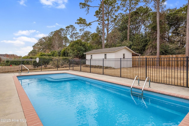 view of pool with an outdoor structure and a patio area